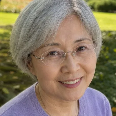 Close crop of the portrait at 100%, showing the same pores, lines, and skin tone as the upload