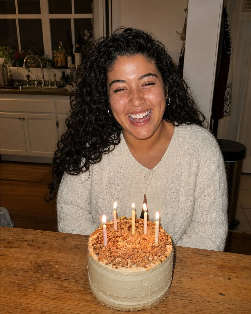 The same birthday photo with the flash shine and blotchy redness evened out while every freckle and curl stays