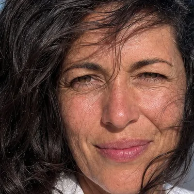 Close crop of the profile picture at 100%, showing the same pores, lines, and skin tone as the upload